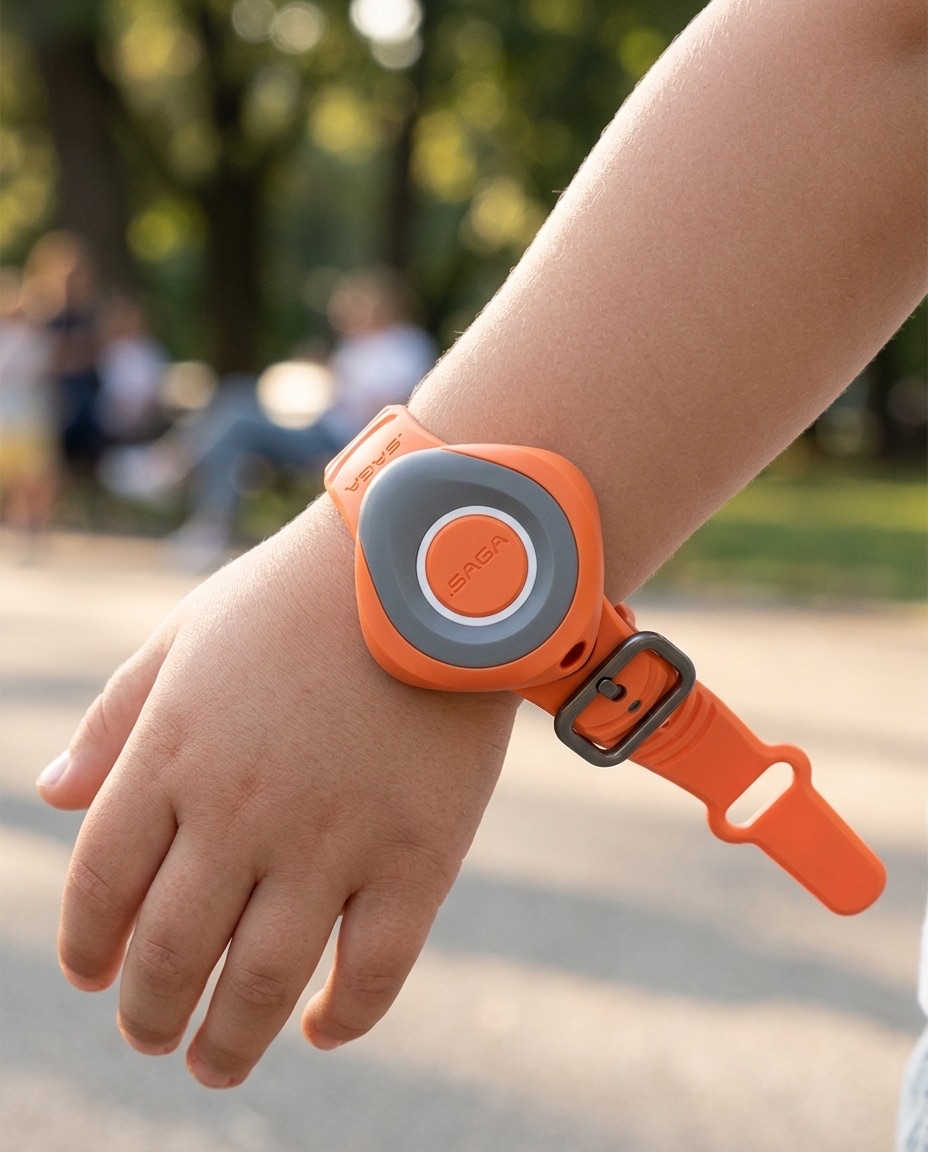 A young child wearing an orange dot SAGA MyBand tag on the wrist