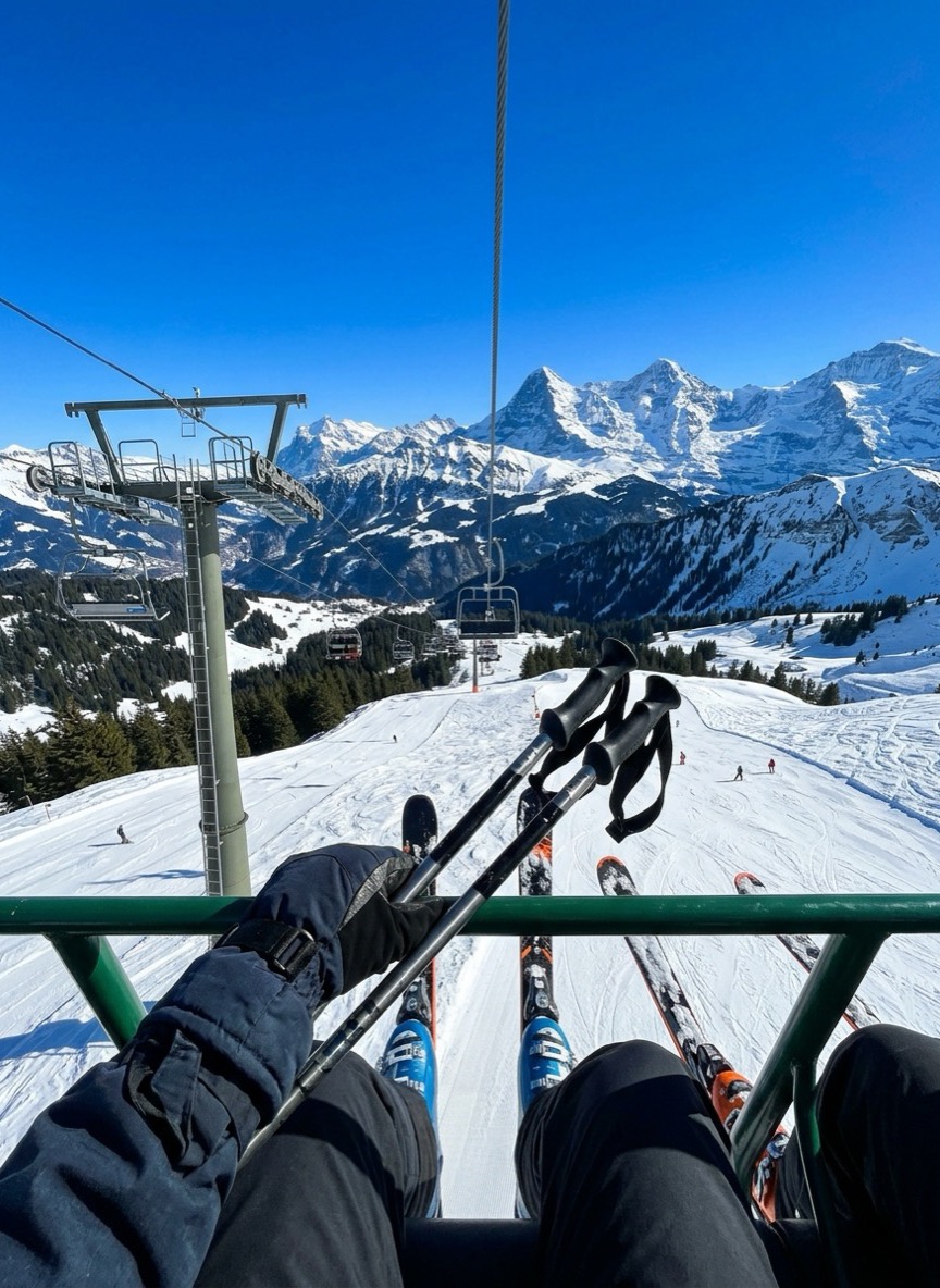 Skier on a chairlift wearing a MyBand tag